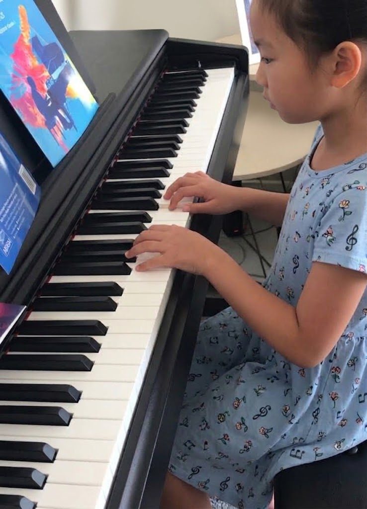 A pupil playing the piano
