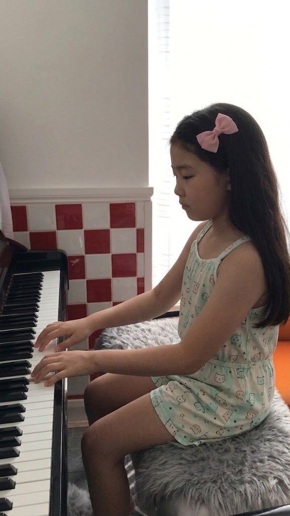 A pupil playing the piano